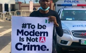 EndSARS protester pictured with placard